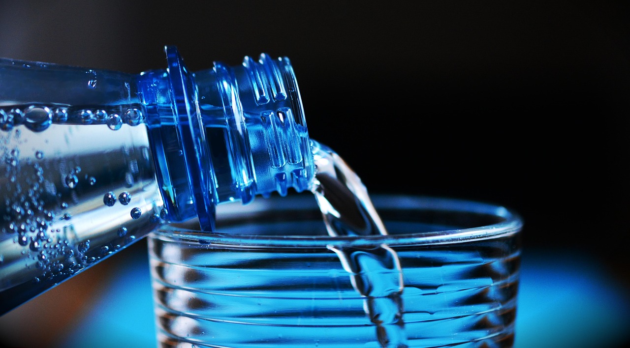 Pouring glasses of water for hydration