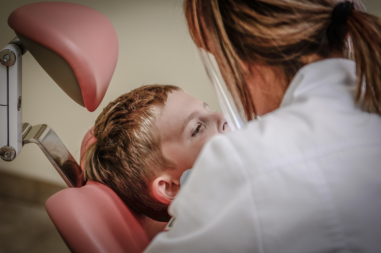A podiatrist or doctor examining a patient's foot for signs of gout