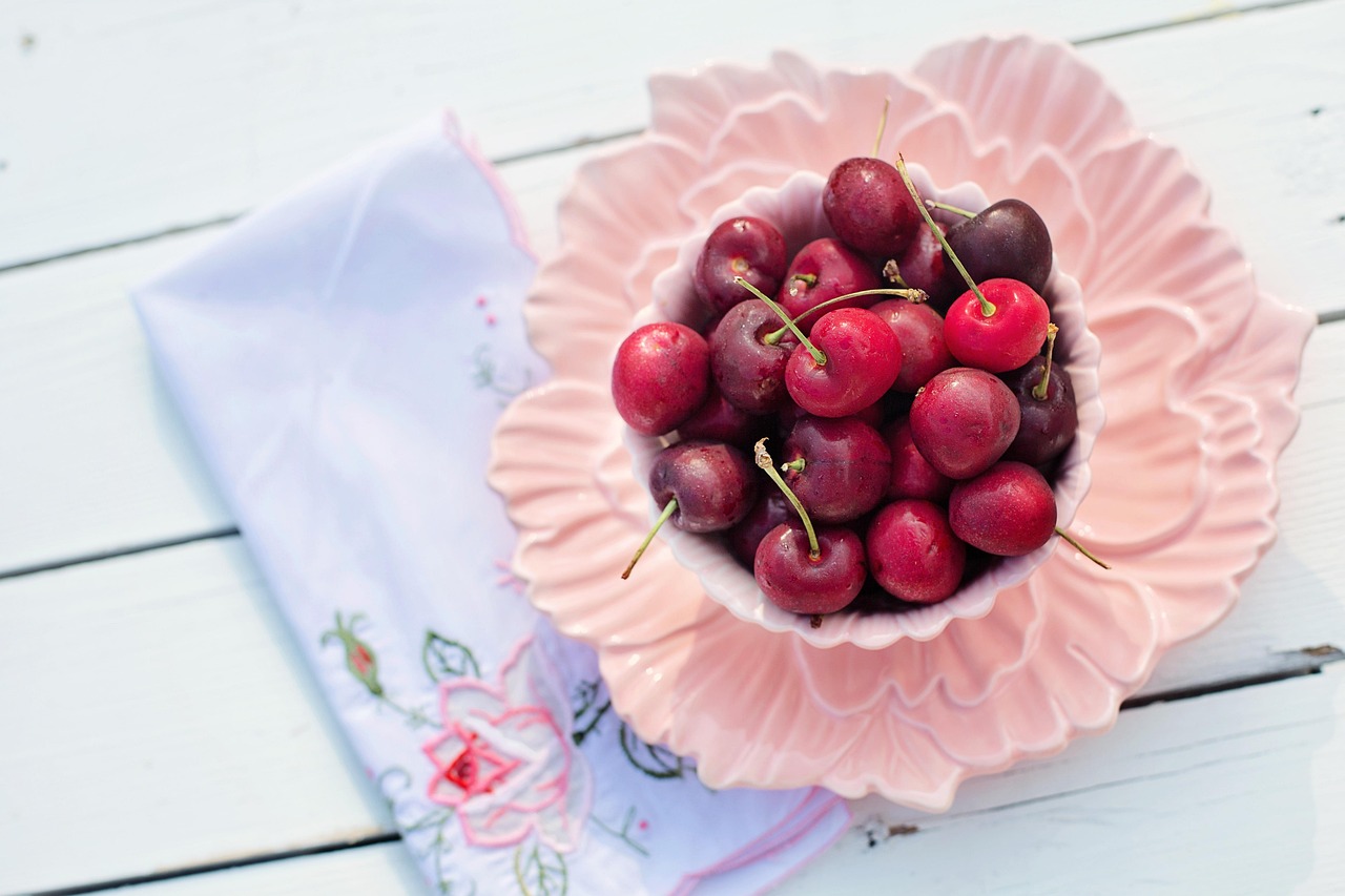 Fresh tart cherries in a bowl, a common natural remedy for gout inflammation