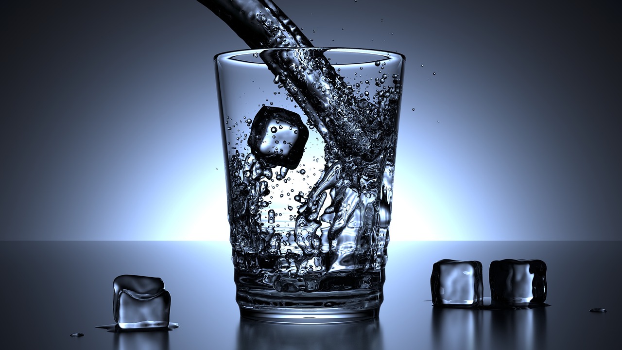 Drinking a glass of water for hydration